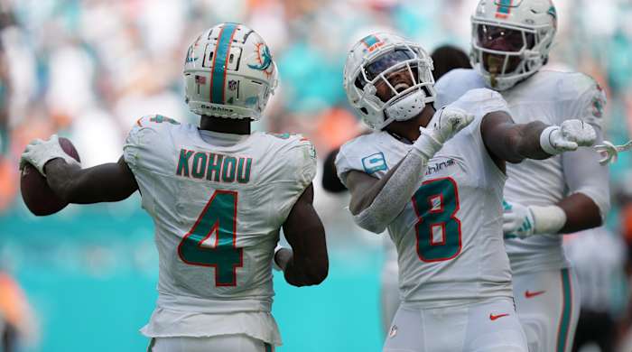 Dolphins safety Jevon Holland celebrates creating a turnover against the Broncos